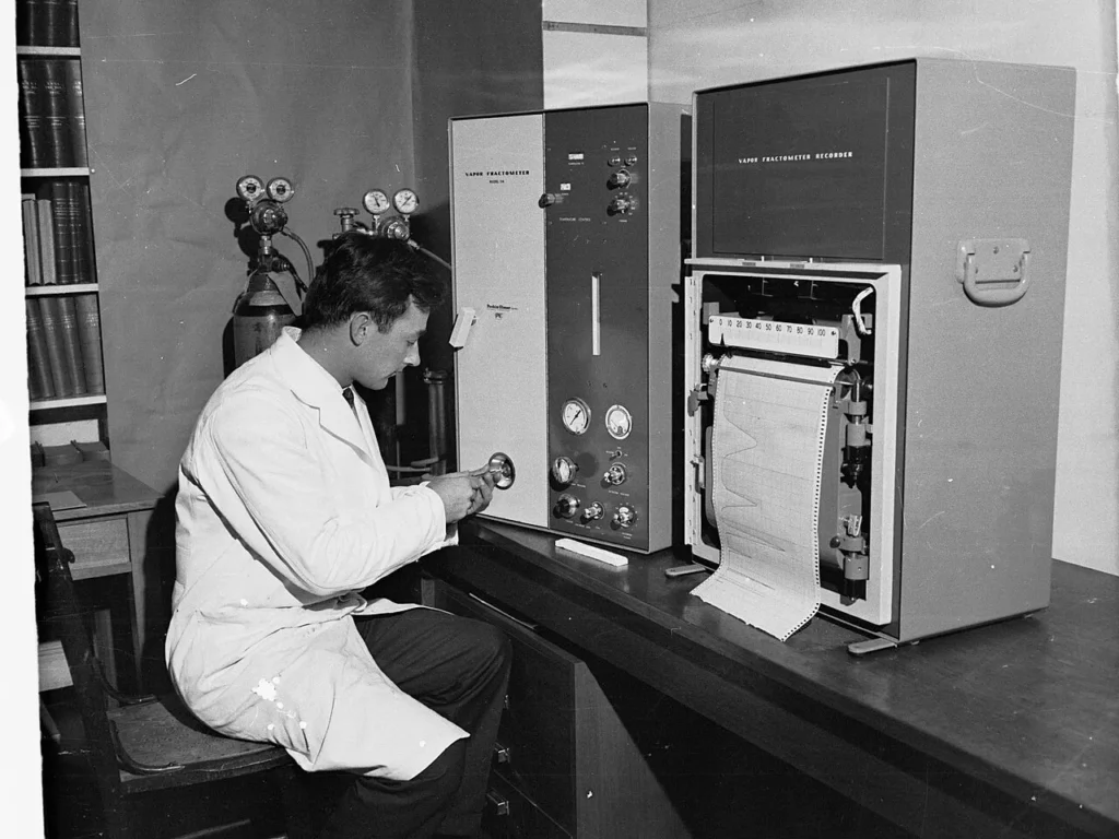 A scientist working with samples in a laboratory that supports disease tracking.